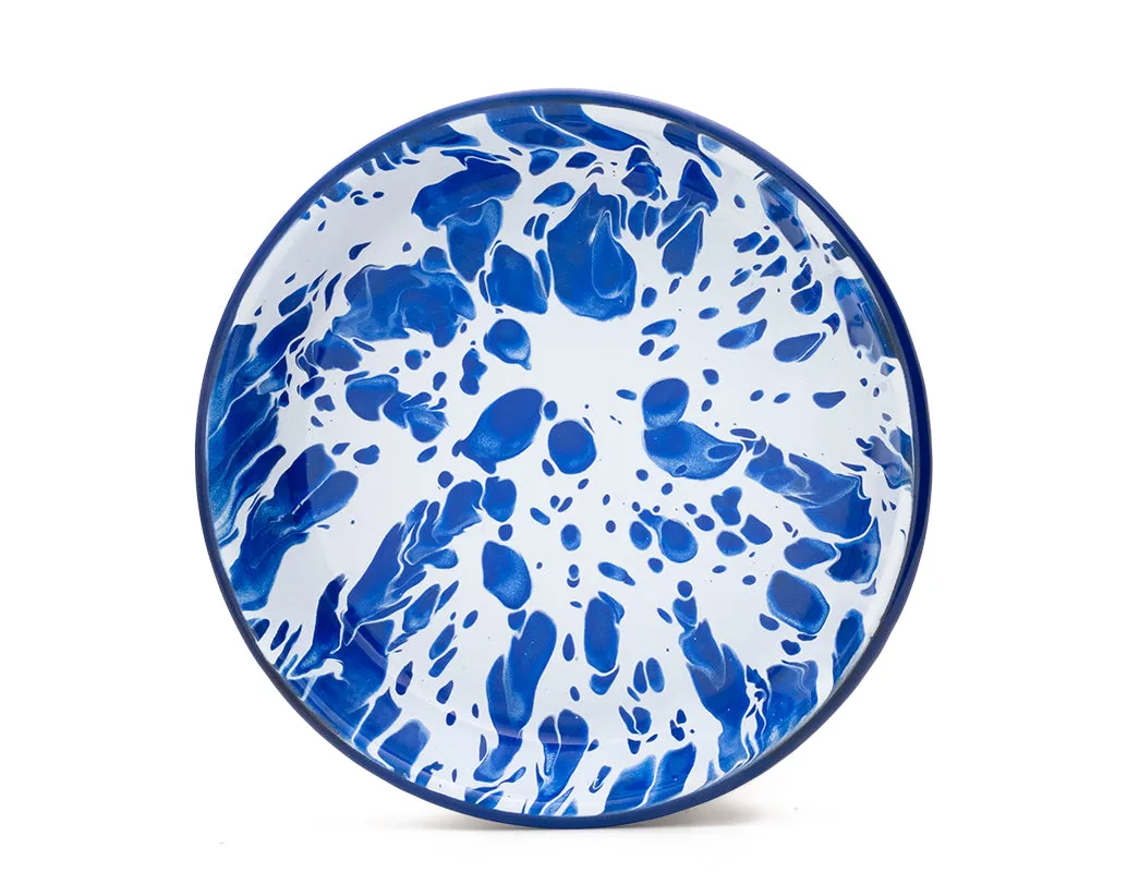 Plato hondo de peltre blanco con manchas azules y borde azul
